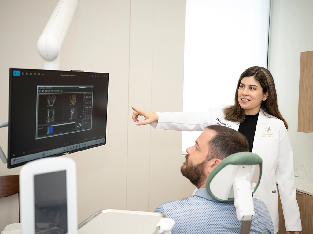 Oak-Creek-Endodontics-doctor azar consulting with a patient